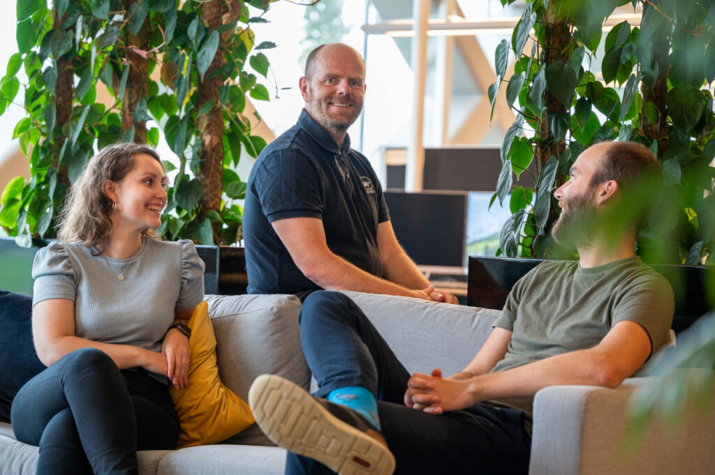 Smilende IT-konsulenter i Upheads